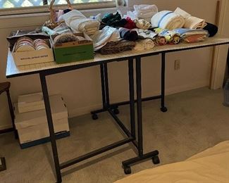 Sewing Cutting Table very Versatile with Drop Leaf Sides for Storage and Wheels that Lock into Place Once Positioned Includes Cutting Mat Layout