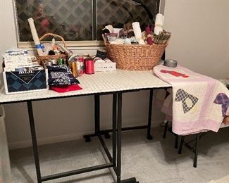 Sewing Cutting Table very Versatile with Drop Leaf Sides for Storage and Wheels that Lock into Place Once Positioned Includes Cutting Mat Layout