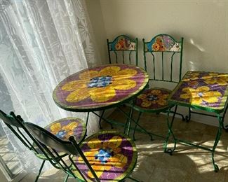 Colorful 6 pc mosaic sun room or patio set. Metal base. Patio table, smaller side table and 4 chairs.