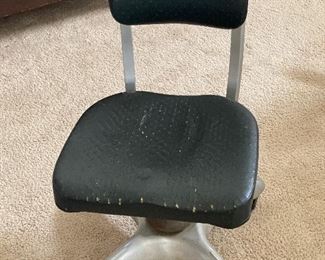 Antique metal, aluminum and vinyl adjustable swivel office chair.