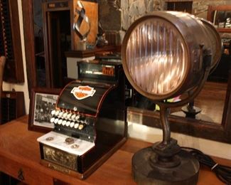 Vintage Harley Davidson themed cash register; nautical lamp
