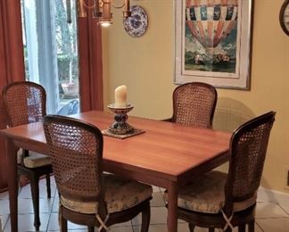Cherry kitchen table. Cane back chairs