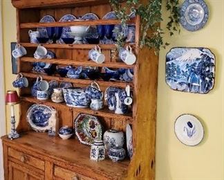 Awesome pine hutch. Tons of blue and white pottery pieces. 