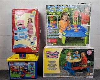 1 - Sand & Water Wheel Play Table by "American Plastic Toys" - NEW in open box  1 - Picnic Table by "American Plastic Toys" - NEW in Factory sealed box  1 - Betty Crocker Play Electronic Kitchen Stove- 14 pieces - NEW in open box  1 - Preowned Mega Bloks Tiny'n Tuff Fast Tracks Race way Track - includes (27 pieces with box and top)