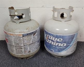 (2) 5 gallon propane tanks - 1 is full with seal