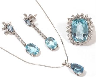Lot 109 | (4PC) AQUAMARINE & DIAMOND DEMI PARURE | A matching set in 14k white gold, including: a pair of drop earrings designed as oval cut aquamarines each surrounded by a cluster of 8 diamonds suspending a line of 6 round diamonds terminating in an oval cut aquamarine; a ring with a rectangle cut aquamarine surrounded by two halos of diamonds (with sizer, size 7.5-8); and a pendant with a pear cut aquamarine crested by a single diamond on an Italian gold chain; all together 27.5g