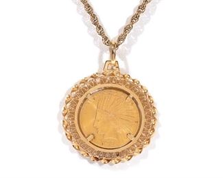 Lot 118 | 1926 INDIAN HEAD $10 COIN NECKLACE | Designed as a 1926 Indian head $10 gold coin set in an Italian 18k yellow gold bezel on a 14k gold chain; total weight 33.7g