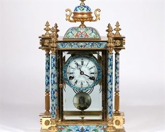 Lot 134 | CHINESE REPUBLIC CLOISONNE BRACKET CLOCK | Mid-20th century, in the Louis XVI-style, the face with roman numerals, the case with cloisonne decorated column supports and finial, having scrollwork on a light blue ground, with an enameled portrait pendulum, with metal tag on the bag of the case reading, "MADE IN THE PEOPLE'S REPUBLIC OF CHINA"; h. 17-1/2 in.