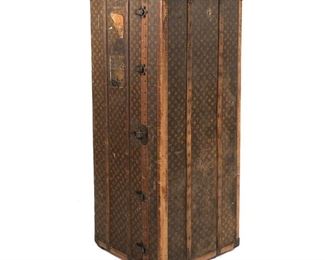 Lot 141 | LOUIS VUITTON WARDROBE STEAMER TRUNK | Brass bound and with brass hardware, with allover Louis Vuitton print and painted monogram "Mme G.A.K" with Louis Vuitton label to interior, no. 196399; h. 55 w. 22 d. 22-1/2 in.