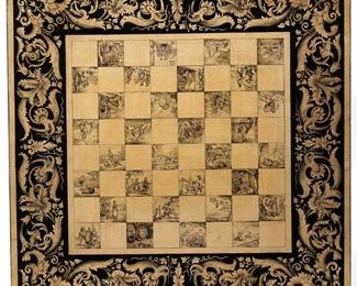 Lot 146 | EBONIZED PENWORK PEDESTAL GAMES TABLE | The top with a game board having alternating squares each decorated with unique scenes of figures engaged in various activities, within a border of scrolling acanthus vines, over an ebonized and gilt decorated turned pedestal raised on a triangular platform with gilt leaves and insects, turned feet mounting casters; h. 28 w. 20-1/4 d. 21 in.
