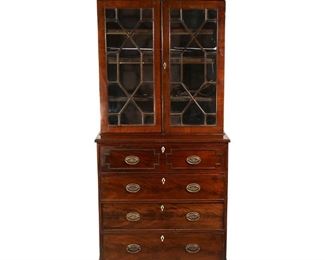 Lot 152 | GEORGE III MAHOGANY STEP-BACK SECRETARY BOOKCASE | Of small size, three part construction, with glazed doors over a drop down drawer front revealing pigeon holes and a leather inset writing surface, over three full-width drawers, with removal bonnet; h. 83 w. 37 d. 18 in.