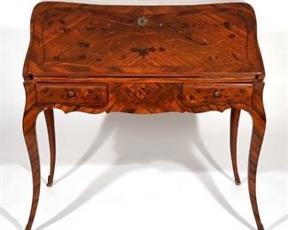 Lot 157 | 18TH C LOUIS XV MARQUETRY & ORMOLU BUREAU EN PENTE | C. 1760, having rosewood & walnut bombe case: top, conforming sides, back and lid, interior fitted with serpentine central drawer over well, flanked by three step back serpentine drawers on each side, case with two shaped drawers, continuing to cabriole legs ending in sabots, with overall marquetry and parquetry, two part construction; h. 40 w. 41 d. 24 in.