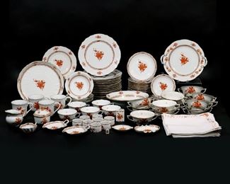 Lot 252 | HEREND CHINESE BOUQUET, RUST PATTERN | Partial dinner service, comprising: 15 dinner plates (dia. 10 in.), 3 low dishes, 13 double-handled soup bowls with 14 underplates, 4 bowls, a round serving dish (dia. 11 in.), a handled serving dish (w. 11 in.), a vegetable bowl, 5 teacups and 5 saucers, 4 coffee cups, a covered sugar with rose finial, open creamer, a small leaf-formed bowl, 2 leaf-form nut dishes, 2 different ashtrays, a matchbox cover, a cigarette holder, and 8 napkin rings with 8 matching linen napkins n.b. set comprises 83 pieces of china plus 8 linen napkins