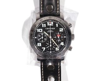 Lot 290 | CHOPARD "MILLE MIGLIA" CHRONOGRAPH | Stainless steel case (dia. 44mm over crown) on a black leather band with matching Chopard buckle closure, black dial with luminescent Arabic numeral markers, three subdials for hours, minutes, and seconds, engraved tachymeter bezel; with velvet Chopard soft case