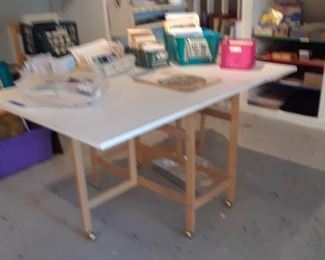 Folding work table on rollers