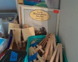 Small wood easels and books on art techniques