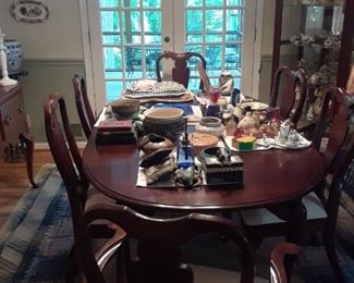 Mahogany Oval table with two leaves; six Queen Anne style chairs, two arms and four sides
