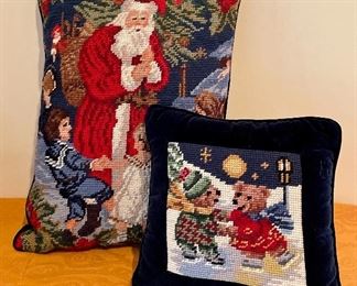 Item 242:  Santa needlepoint pillow (left):  $28                                                     Item 243:  Skating bears needlepoint pillow (right):  $28