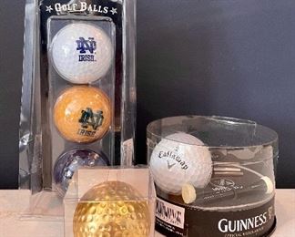 Item 293:  Lot of golf balls including gold golf ball: $12