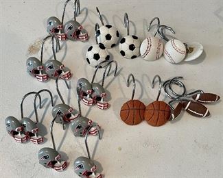 Item 294:  Lot of sports themed shower curtain hooks:  $12