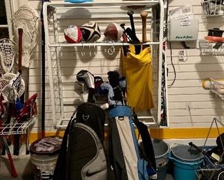 Golf Clubs, balls, hockey sticks, and more in the garage!