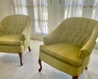 Pair of upholstered, tufted arm chairs