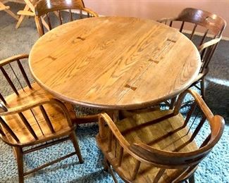Round Wooden Table with Four Captain’s Chairs