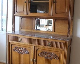 62.  $450.00. Art Deco Oak Sideboard with marble top work surface 78” X 49” X 19” 