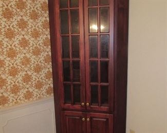 One of two mahogany corner cabinets