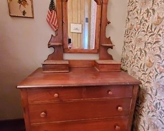 Dresser with carved vanity mirror