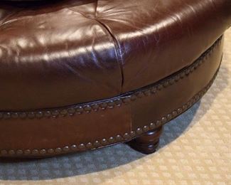 Cordovan leather tufted ottoman (detail), nailhead trim