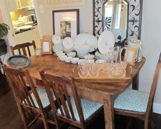 Antique reclaimed barnwood handmade dining table & antique chairs. Wrought-iron decor & beveled mirrors. Southern living pitcher & glassware.