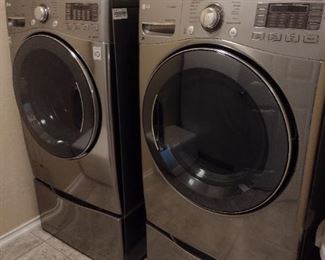 Front loading LG washer and dryer with  drawer stands