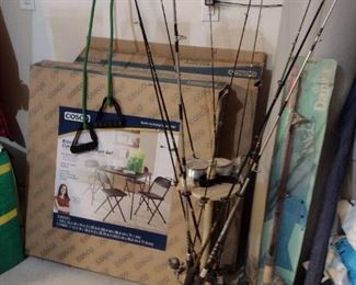 Two card table sets and fishing poles and fly reels