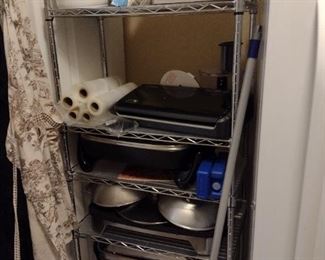 Lots of kitchen appliances and shelving