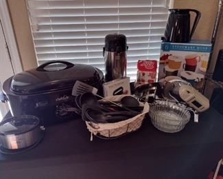 Turkey roaster, meat slicer , kitchen utensils. 