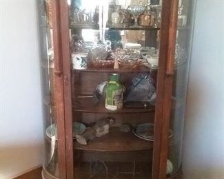 Antique round-front display cabinet