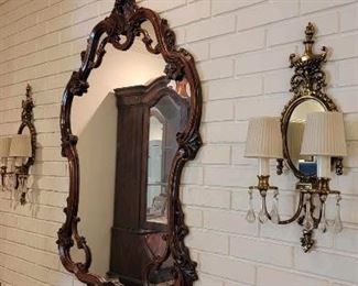 55.  $225.00  Gilded gesso mirror.  Rococo style.  C. 1960.                                                                                                           
                                                                                                                    56.  $250.00  Wall sconces.  Double arm candelabrum with drop suspended prisms. Electrified. 