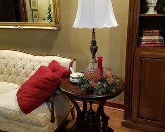 One of two matching round accent/end tables.