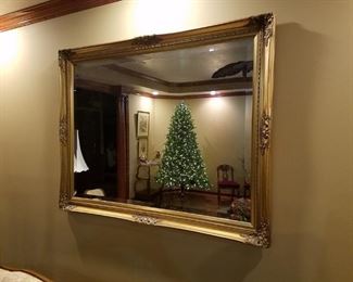 Large  beveled mirror in ornate gilt frame