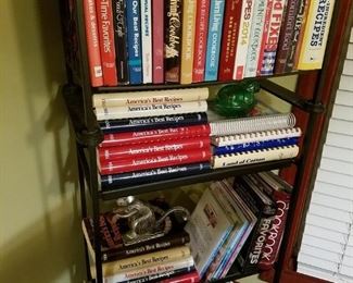 Metal shelf full of cookbooks 