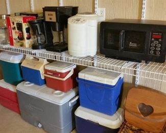 Assorted small kitchen appliances and coolers