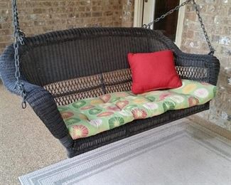 Wicker porch swing