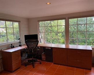 Corner desk by California Closets. Solid wood with laminate top. Excellent condition.