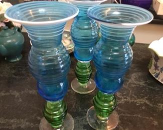 Three large glass candlesticks/vases