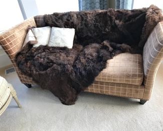 Love seat with an alpaca throw