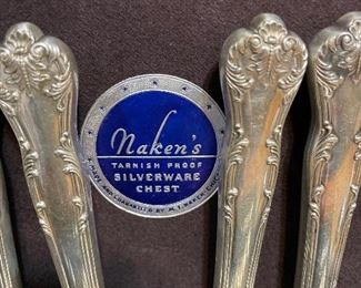 #56___$1,950
Sterling silver flatware 113 pieces Chatelaine (1894)
12 Dinner knifes 
12 Dinner Forks 1.67 oz x12 = 20 oz
24 Teaspoons 1.10 oz x 24 = 26.4 oz
12 soup spoons 1.23 x 12 = 14.76 oz
12 dessert forks 1.15 oz x 12 = 13.8 oz
12 butter spreaders 0.96 x 12 = 11.52 oz
11 ice tea spoons 0.98 x 11 = 10.78 oz
12 appetizer forks 0.76 x 12 = 9.12 oz
1 carving set 
1 cake server 
2 serving spoons 3.18 oz
1 meat fork 1.66 oz
1 sugar spoon 0.80 oz 
Total 113 pieces 		Total weight 112 oz
The key mark was originally from Franklin silver plated company then after 1920’s scarcely used by Lunt.