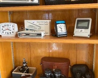 vintage TI calculators, binoculars, radios, clocks