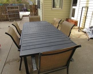 Large patio table with 6 chairs- cover included
