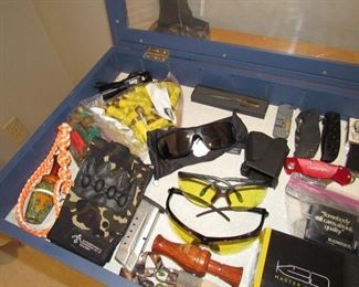 Duck calls, knives, some ammo, oakley sunglasses